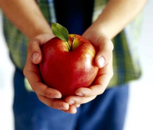 boy holding an apple